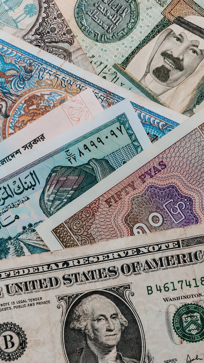 From above of different banknotes with illustrations of Presidents and words with hieroglyphs and symbols on paper surface